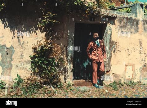 View Of A Dapper Mature Bald Black Guy With A Beautiful Beard And In A Fashionable Custom Made