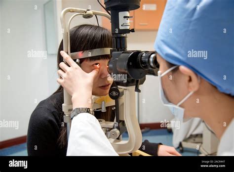 eye test ophthalmologist   slit lamp ophthalmoscope
