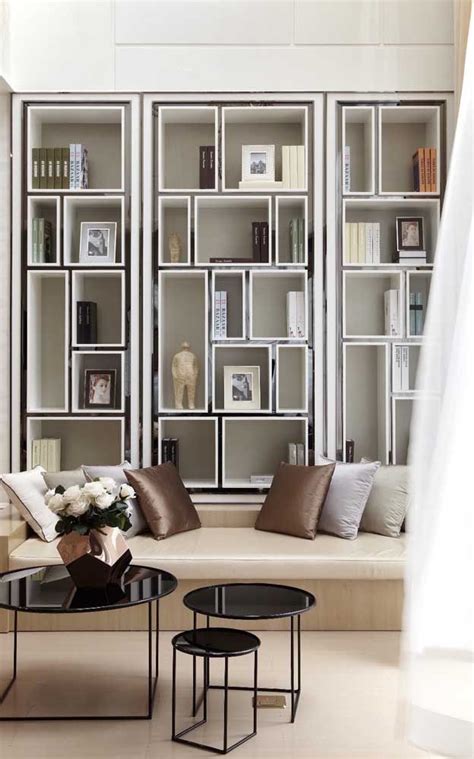 A Living Room Filled With Furniture And Bookshelves