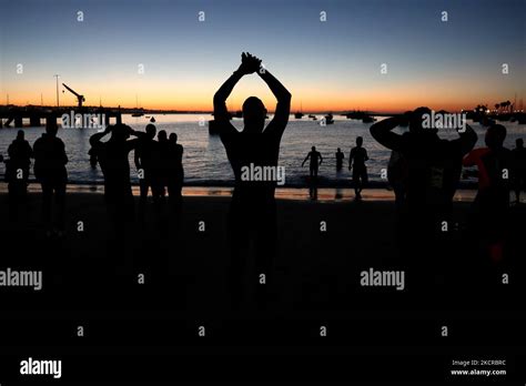 Athletes Warm Up For The Swim Leg During The 2021 IRONMAN Portugal In