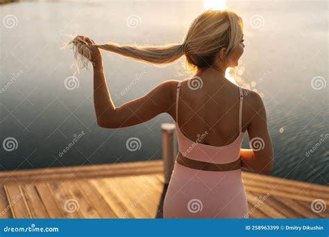 Back View Of Unrecognizable Athletic Blonde Woman In Sportswear