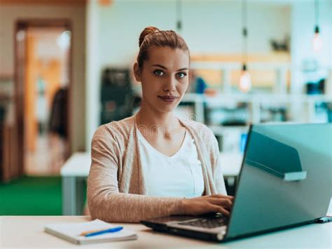 Blonde Manager Working Behind Her Desk In A Modern Office Stock Photo Image Of Designer