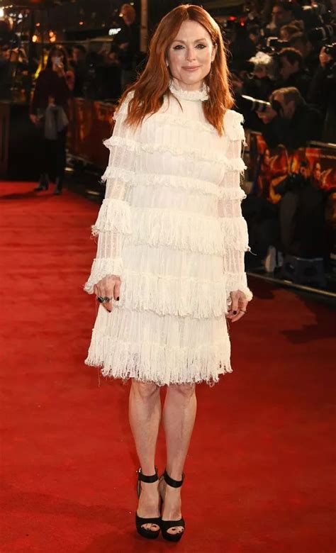 Jennifer Lawrence Flashes Side Boob In Striking Dress As She Leads Stars For Hunger Games London