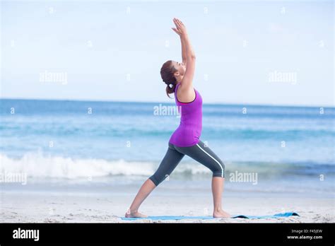 Brunette Doing Yoga On Exercise Mat Stock Photo Alamy