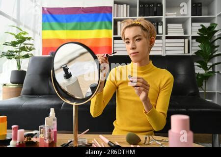 Smiling Asian Gay Man Blogger Filming Daily Makeup Routine Tutorial On Smartphone LGBTQ