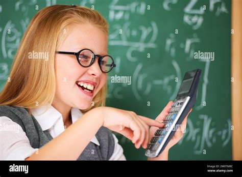 Maths Is Easy When You Use Your Calculator A Cute Blonde Girl Adding On Her Calculator In Class
