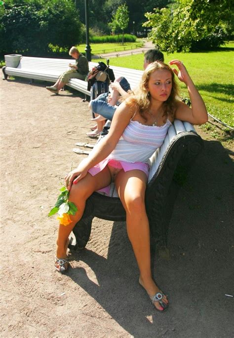 Sitting On The Park Bench And Flashing Her Pussy In A Short Skirt