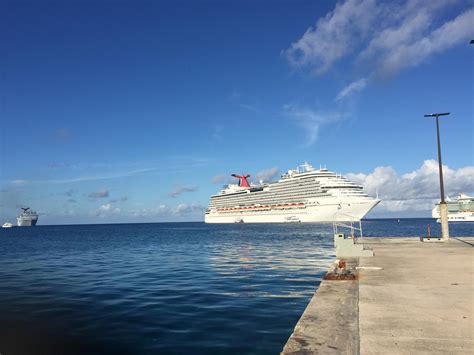Three cruise ships while at port at the Grand Cayman Islands : r/pics