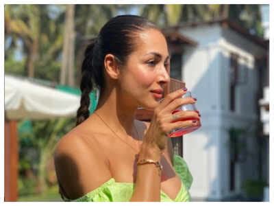 Malaika Arora Stuns In A Green Bikini As She Chills By The Poolside In