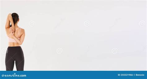 Full Length Rear View Of Active And Slim Brunette Asian Fitness Girl Female Athlete Warm Up