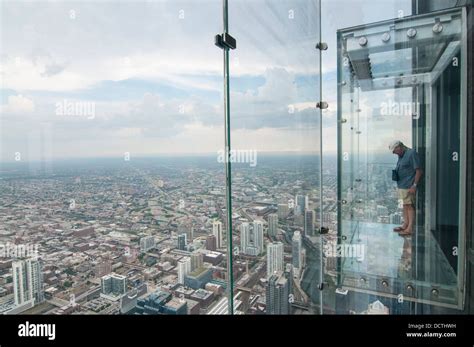 Male tourist in the SkyDeck at the Sears (now Willis) Tower, Sky Deck ...