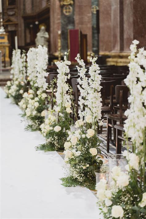 Classically Elegant Wedding Aisle Markers Filled With Lush White Floral