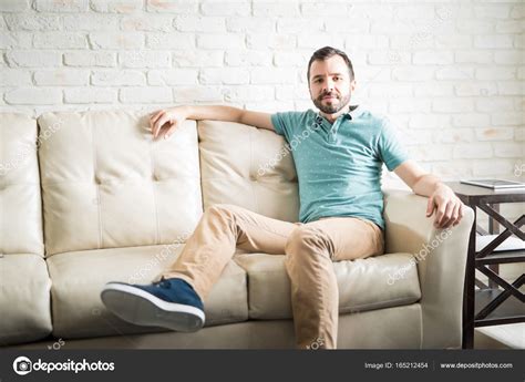Man Relaxing On Couch Stock Photo By ©tonodiaz 165212454