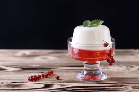 Premium Photo Italian Dessert Panna Cotta With Red Currant Jelly