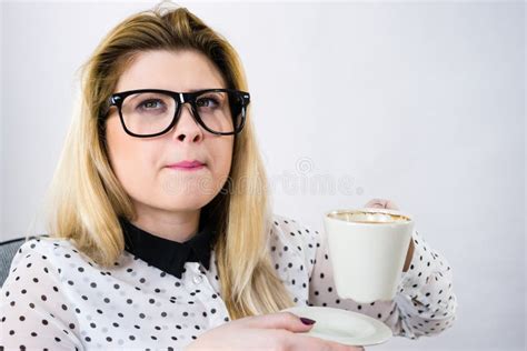Happy Woman At Office Drinking Hot Coffee Stock Photo Image Of Documents Desk