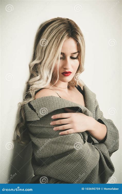 Fashion Blonde Woman Standing Against Wall Stock Image Image Of Hair Gabardine