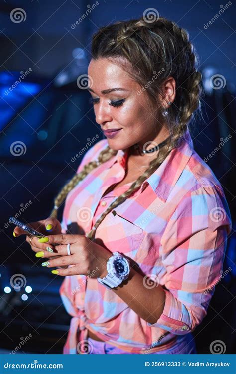 Blonde In Short Denim Shorts With Pigtails Uses Smartphone Stock Image Image Of Engine