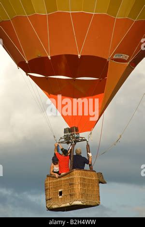Hot Air Balloon With Basket Rises In The Sky 3 Stock Photo Alamy