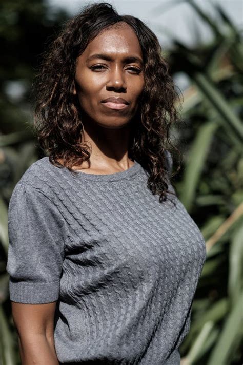 Portrait Of Fitness Mature Black Woman Stretching Against A Banister Stock Image Image Of