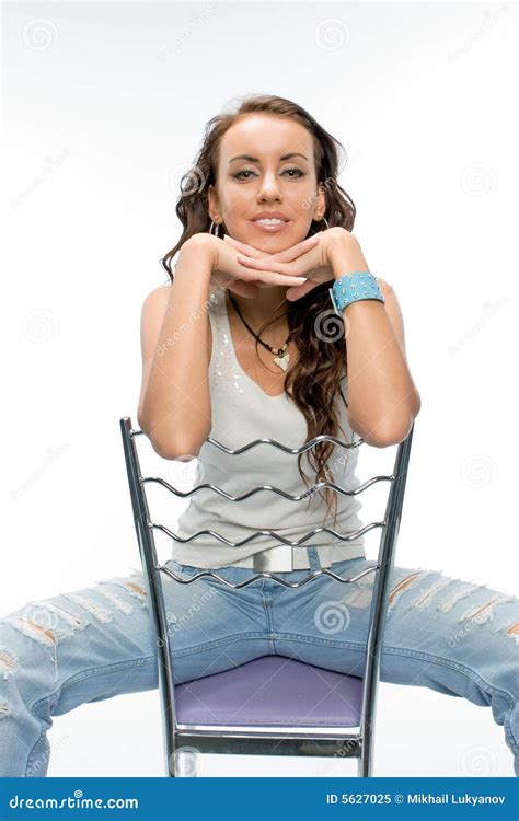 The Beautiful Brunette Posing With A Chair Royalty Free Stock Photo Image 5627025