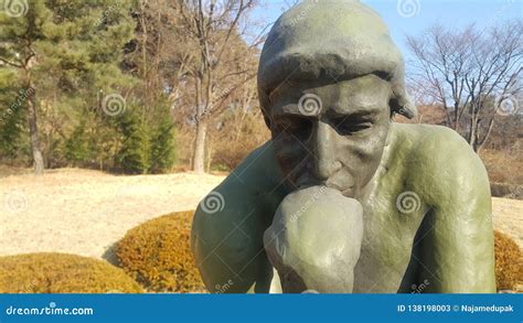 Green Statue Of Thinker Auguste Rodin Setting Naked On A Rock Editorial Stock Photo Image Of