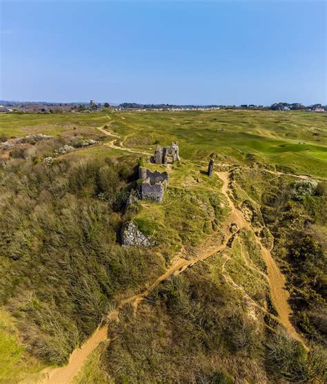 An Aerial View Toward The Castle Ruins From The Three Cliffs Bay Gower