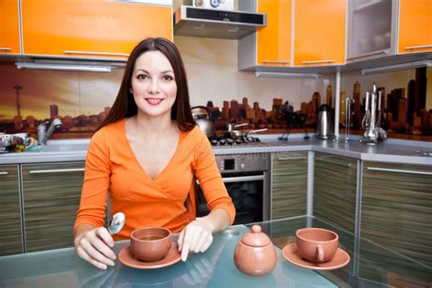 beautiful woman  drinking   kitchen stock image image