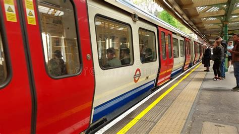 London Public Underground Train Arrive At A Station Stock Video Video