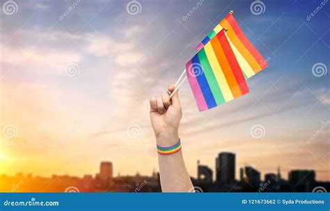 Hand With Gay Pride Rainbow Flags And Wristband Stock Photo Image Of