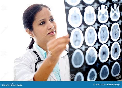 Female Doctor Examining a Brain Tomography Scan Stock Photo - Image of ...