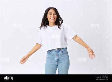 Woman In White T Shirt On White Background Brunette Hands Up Gestures