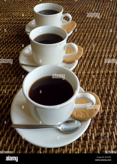 I Always Drink Three Cups Of Coffee In The Morning - Three cups of coffee in a row Stock Photo - Alamy