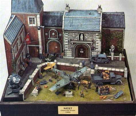 A Model Of A Building With Cars And People Around It