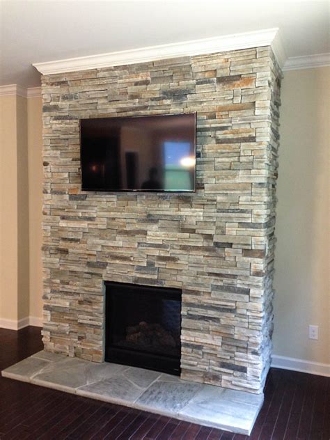 Charlotte Stone and Paver Installation | Natural stone fireplaces, Stone tile fireplace, Corner ...