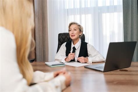 Premium Photo Rear View Of Unrecognizable Blonde Female Vacancy Candidature Applicant Answers