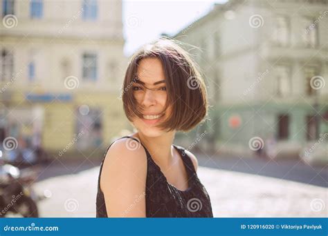 Expressive Brunette Model With Bronze Tan And Natural Makeup Walking Down The Street Space For