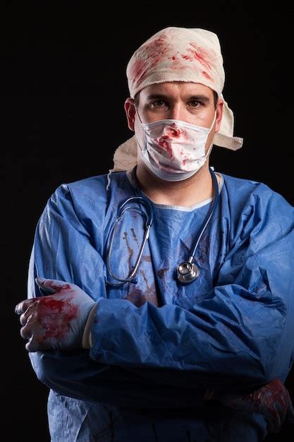 Premium Photo Portrait Of Senior Man Wearing Mask Against Black