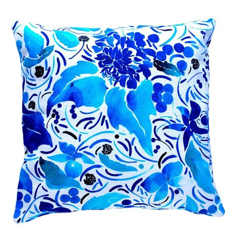 A Blue And White Pillow With Flowers On It