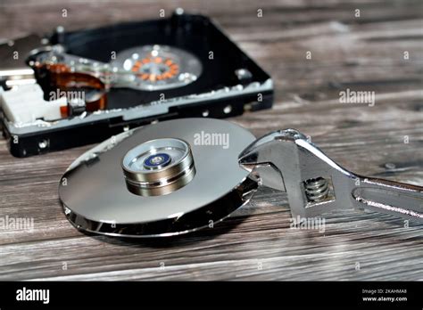 An Adjustable Spanner Wrench And Hdd Platters Together Hard Disk Drive