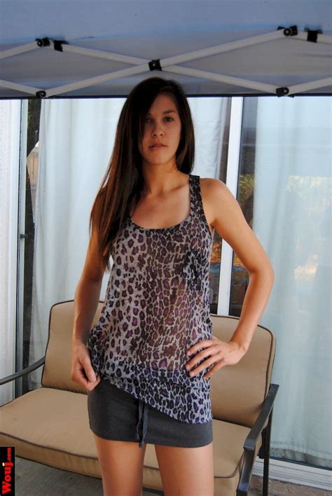 Lovely Brunette Babe Posing In A See Through Shirt Photos