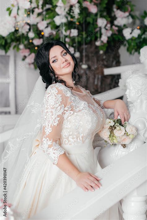 Beautiful Sexy Brunette Bride Plus Size In A Light Photo Studio Wedding Photo Plus Size Model