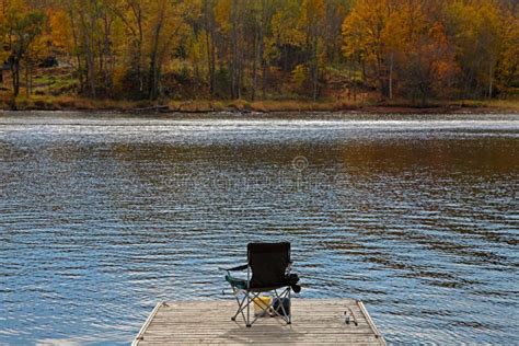 Ready for Lake Fishing on a Dock in the Fall Stock Image - Image of ...