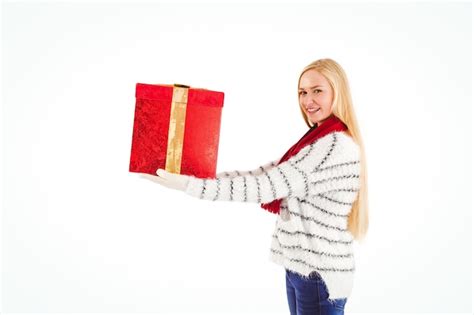 Premium Photo Festive Blonde Holding A Gift