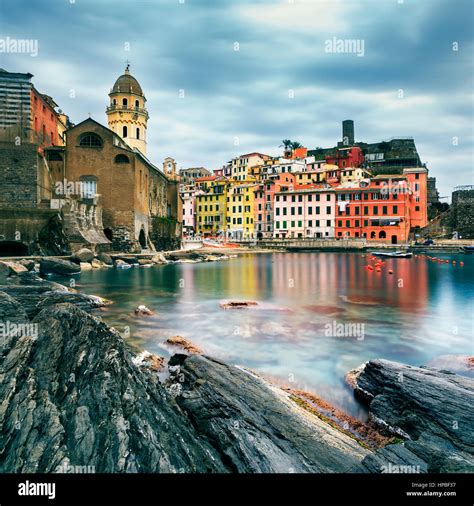 Vernazza Village Church Rocks And Sea Harbor On Sunset Seascape In