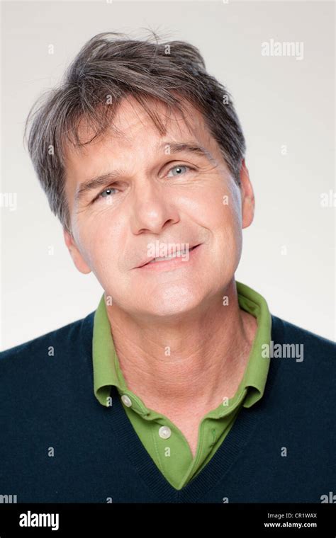 Studio Portrait Of Mature Man Smiling Stock Photo Alamy