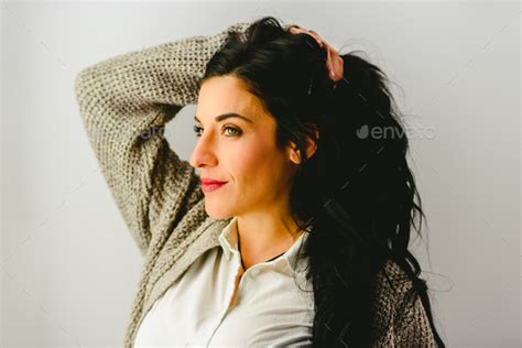 Portrait Of Mature Brunette Woman With Beautiful Eyes In Casual Pose And White Background