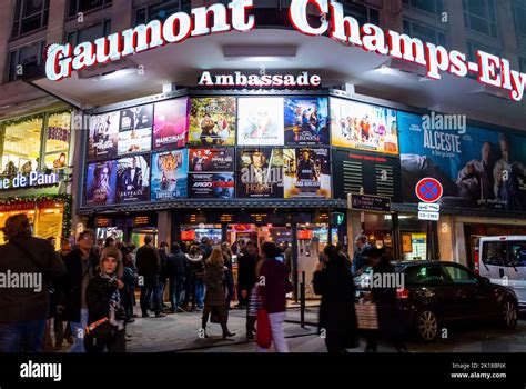 Paris France Large Crowd People Walking Gaumont Cinema Theater Lit Up