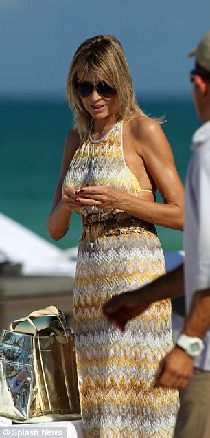 Rita Rusic Wears High Neck Frock Only To Strip Off In A Bikini Yet