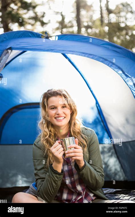 Pretty Blonde Camper Smiling And Sitting In Tent Stock Photo Alamy