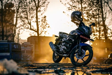 X Resolution Black Naked Motorcycle Parked On Black Pavement During Golden Hour Hd
